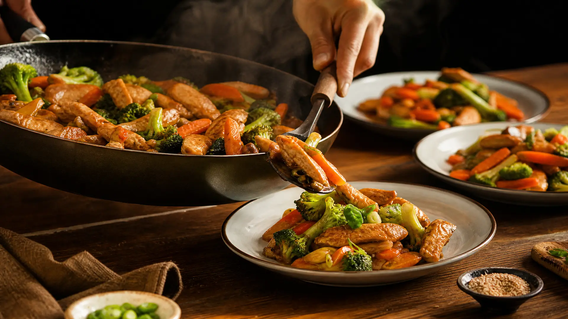 A sizzling hot pan filled with a colorful 15-minute chicken and vegetable stir-fry being served to a family table.